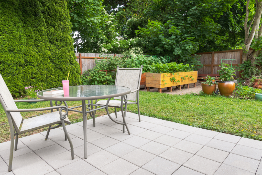 Backyard Patio Garden with Patio Furniture and Raised Garden Beds